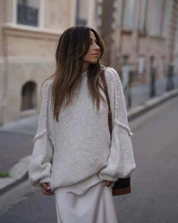 Chic women's oversized knit sweater, fluffy texture. Ideal for casual winter fashion & comfortable layering.