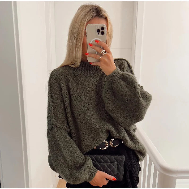Women's cozy oversized fluffy knit sweater. Warm, long sleeve, and stylish for casual winter fashion.