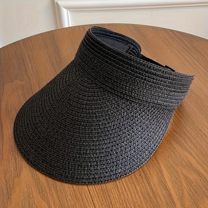 Stylish women's foldable wide brim sun visor hat, a fashion accessory for sun protection & beach travel.