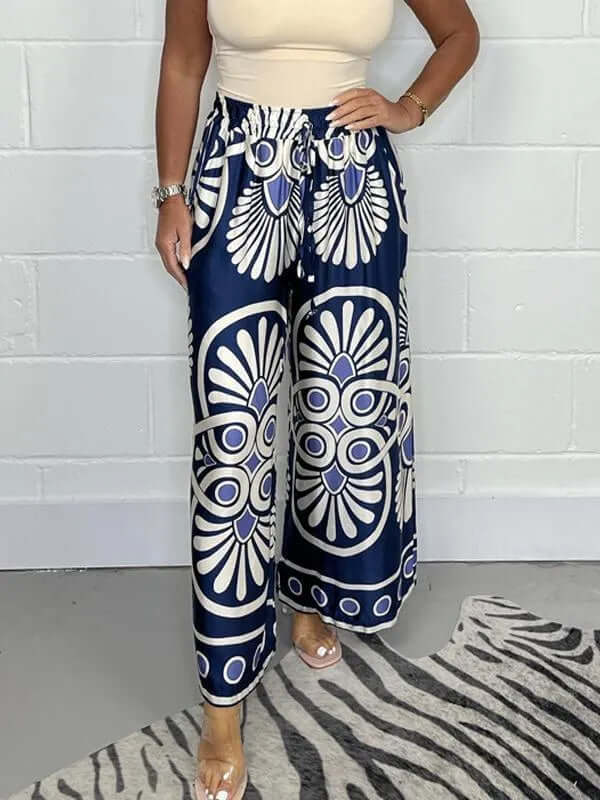 Comfortable women's wide-leg palazzo pants, featuring a stylish geometric pattern and flowy design.