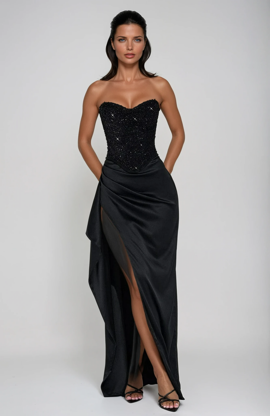Women's glamorous black beaded corset maxi dress for evening events. Elegant formal gown with intricate beading.