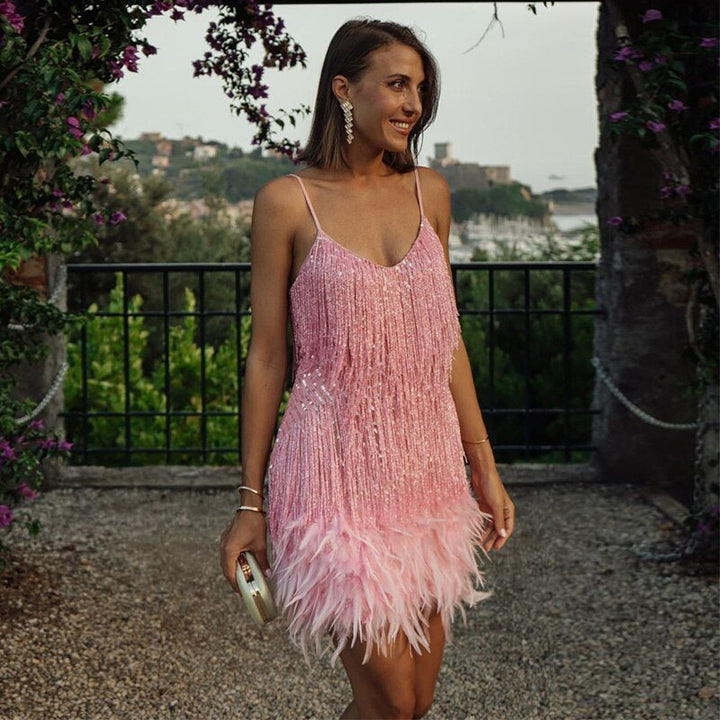Flattering women's feather embellished mini cocktail dress, an elegant choice for any party or evening special occasion.