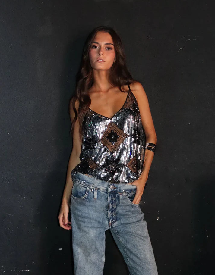 Elegant women's glitter party top with refined pearl details, perfect for a sophisticated and glamorous evening.