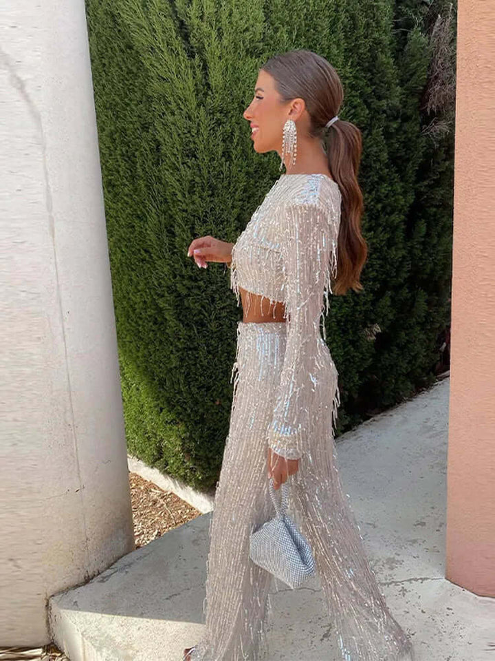 Women's sequin crop top and high-waisted trousers, a chic long-sleeve evening wear set.