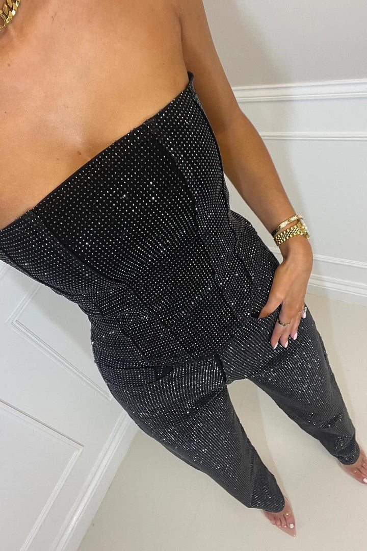 Festive women's high-waist glitter trouser set with a dazzling shimmering top for special occasions.