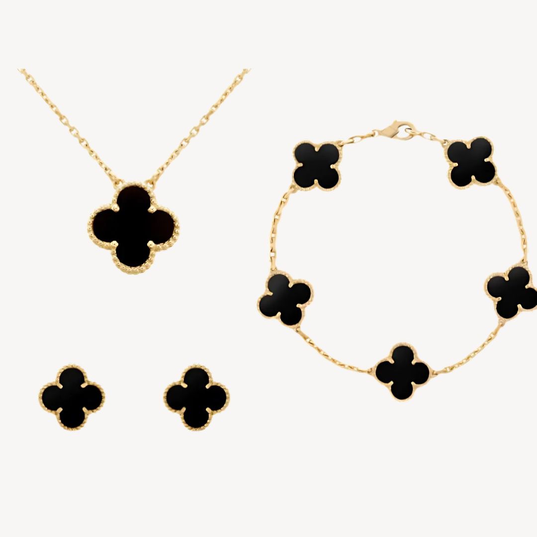Colorful women's gold-tone clover jewelry set, a fashionable lucky charm necklace, bracelet, & earrings.