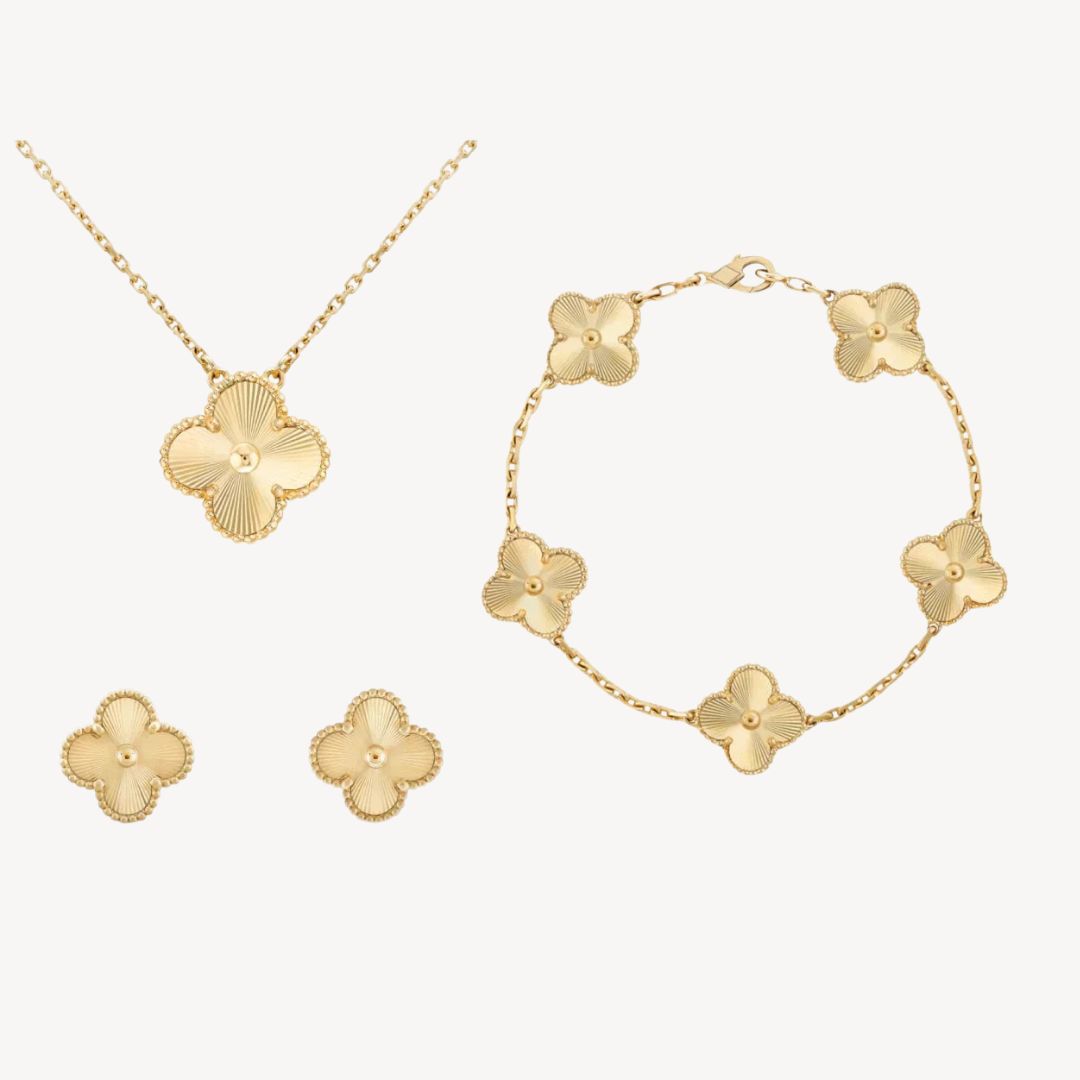 Elegant women's gold-tone clover necklace, bracelet, and earrings set. Perfect gift for her, available in colors.