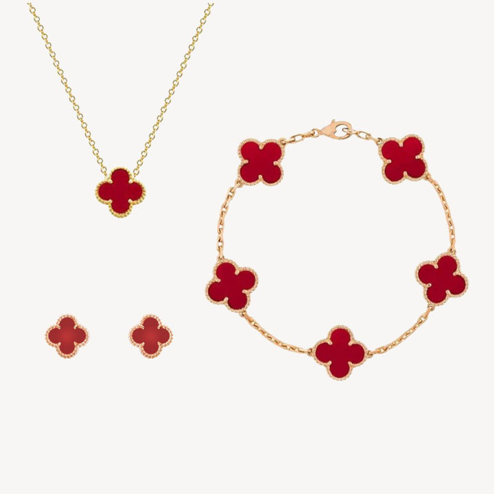 Stylish gold-tone clover jewelry set for women, including a necklace, bracelet, and earrings. A versatile accessory.