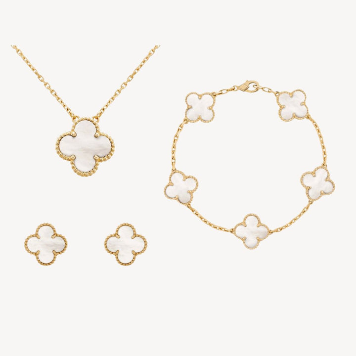 Vibrant gold-tone clover jewelry set for women with colorful options. Necklace, bracelet, & earrings, a lucky charm.