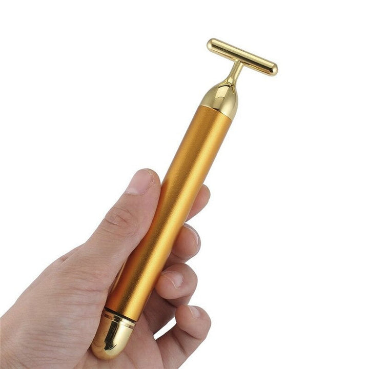 Vibrating gold facial roller for women. Achieve radiant, firmer skin and enjoy a relaxing anti-aging face massage.