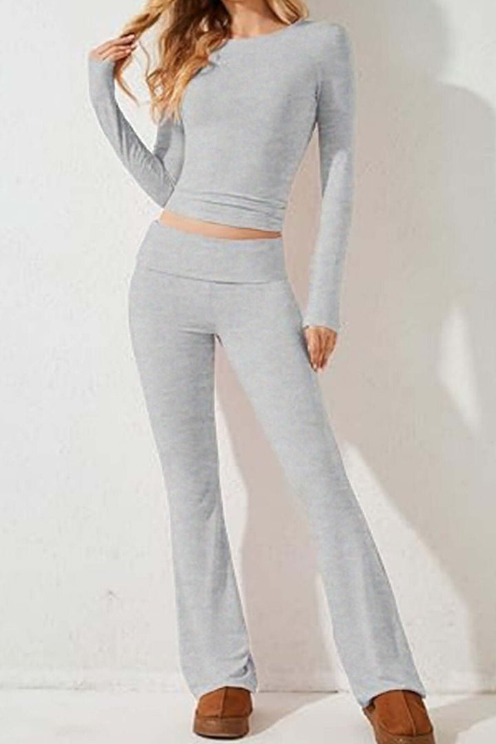 Stylish women's gray knit two-piece loungewear set featuring a cozy long-sleeve top and flared bottoms.