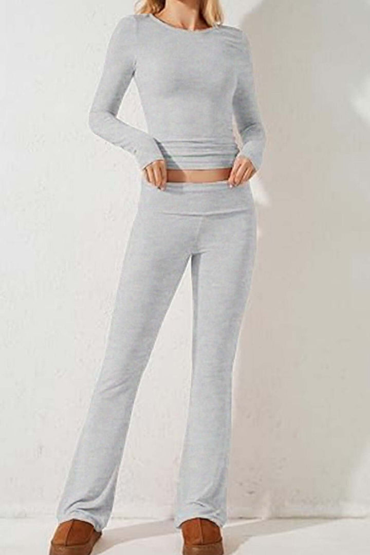 Comfortable gray knit loungewear set for women, including a soft long-sleeve top & relaxed flared pants.