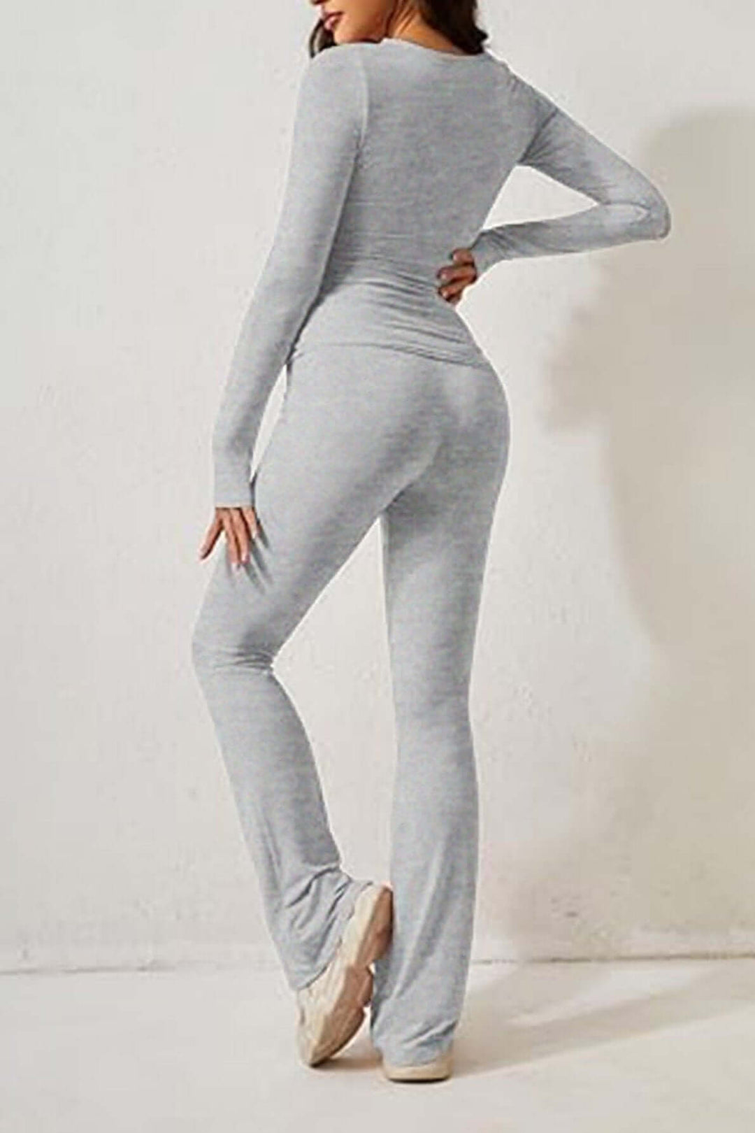 Relax in style with this gray knit women's loungewear set: cozy long-sleeve top and comfy flared pants.