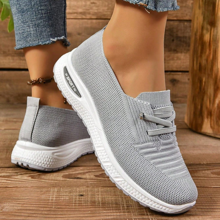 Comfortable gray women's walking shoes, slip-on style, ideal for heel spur relief