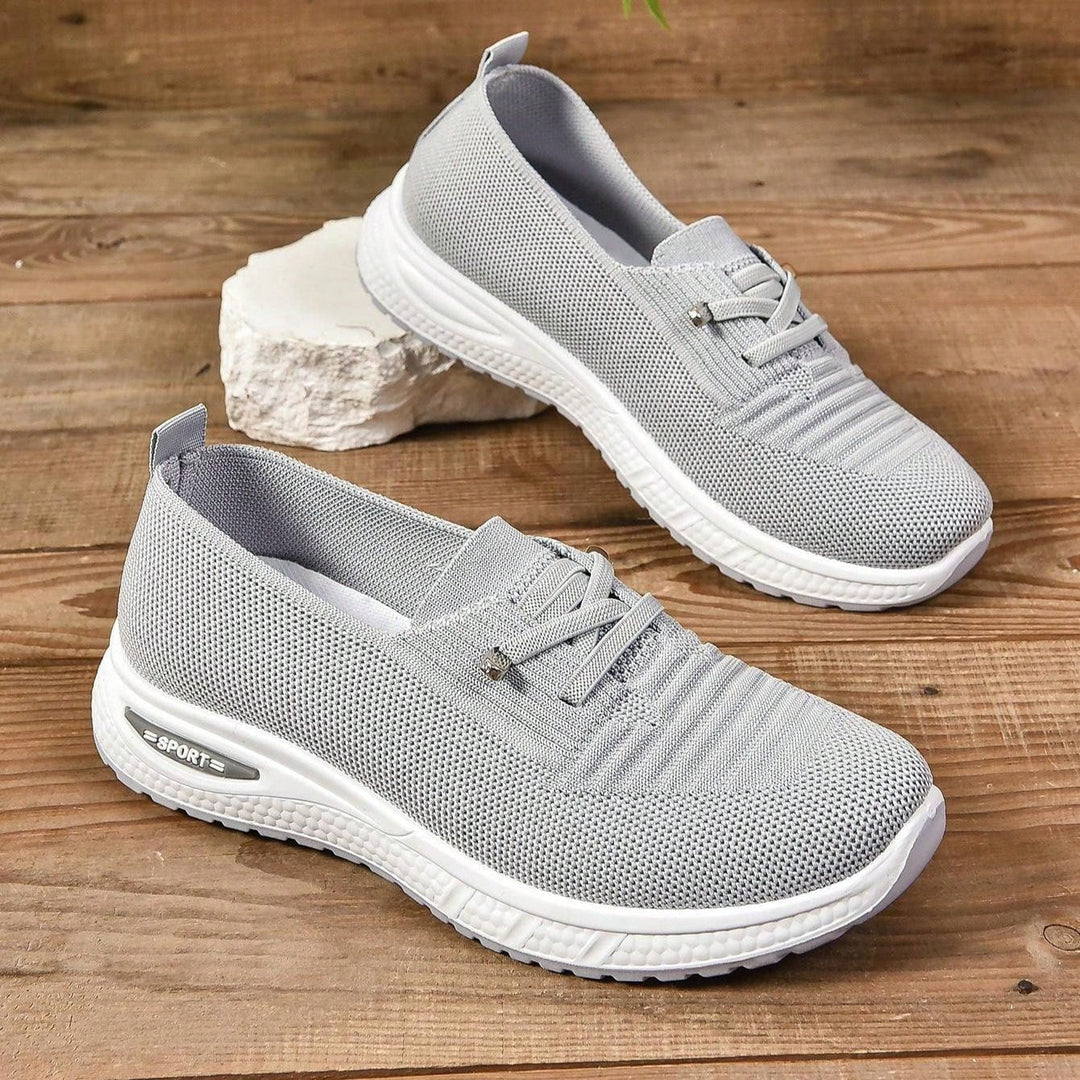 Women's gray comfort sneakers, slip-on design with orthopedic features for pain relief