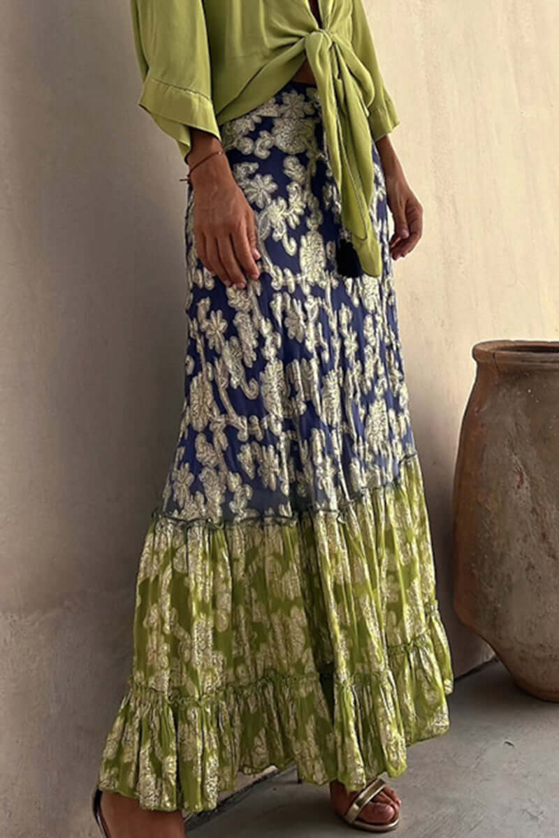 Effortless women's tiered maxi skirt with vibrant floral pattern. Elegant, flowing, and comfortable for summer casual style.