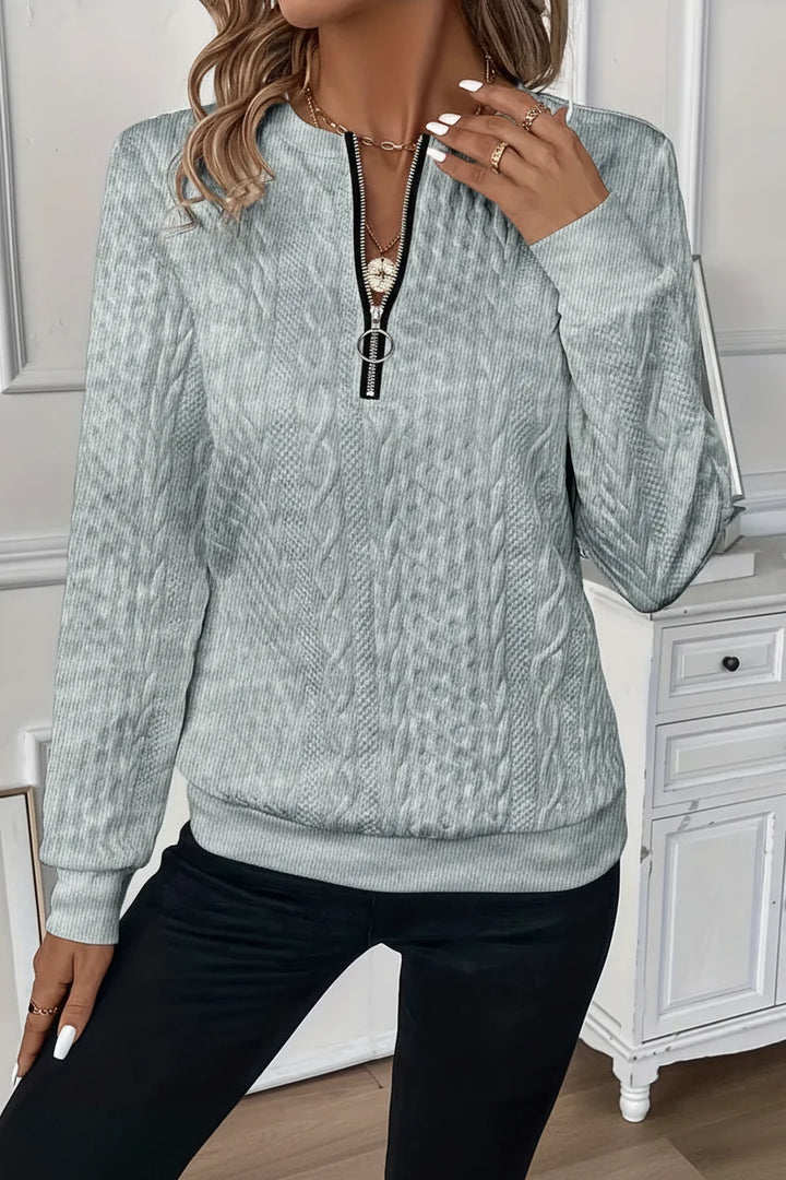 Warm women's half-zip long sleeve jumper. Ribbed hem for a snug fit. Perfect for winter.