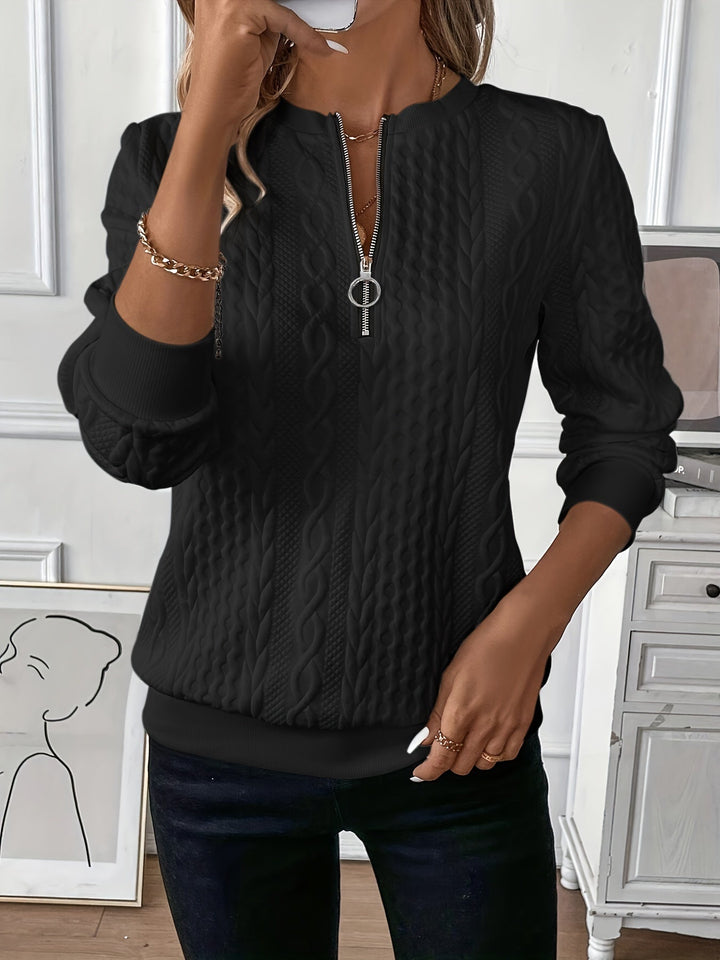 Elegant women's half-zip pullover sweater. Ribbed hem & unique ring pull detail.