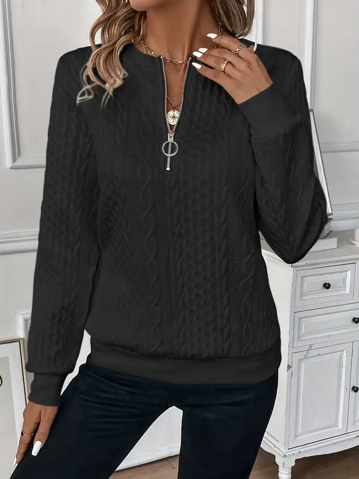 Women's fashion half-zip jumper. Cable knit design & ribbed hem for chic layering.