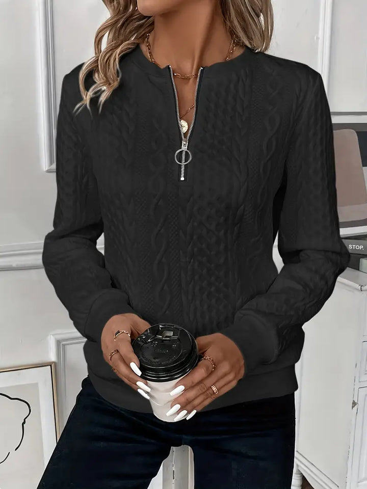 Casual elegance women's half-zip sweater with ring pull. Ideal for transitional weather.