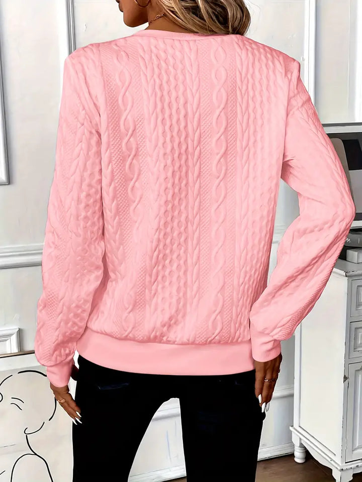 Versatile women's half-zip sweater with ring pull. Great for casual or chic layering.