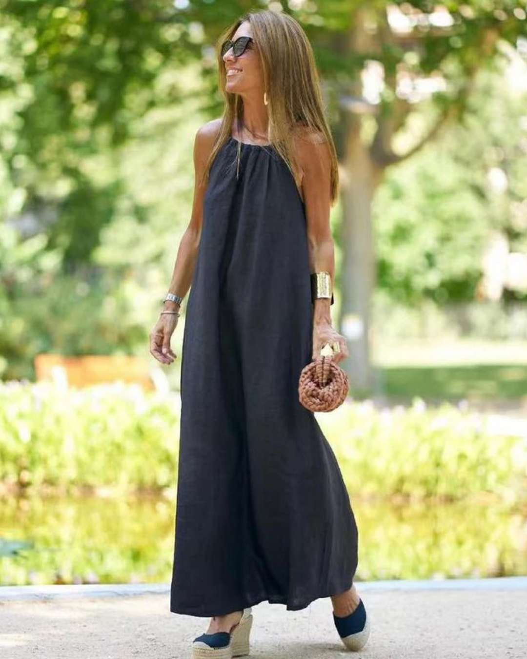 Flowing sleeveless maxi dress for women, ideal for beach outings, resort wear, or a comfortable summer day.