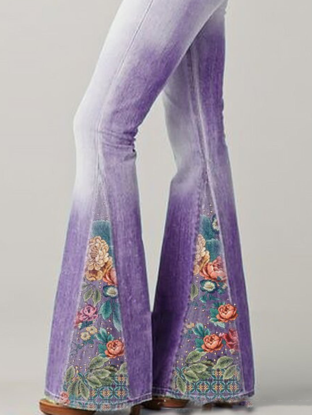 Full-length view of women's high-rise bootcut jeans with eye-catching floral embroidery, designed for comfort.