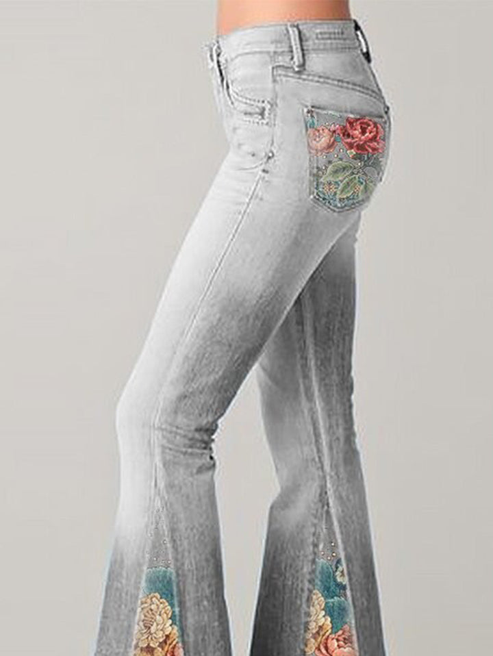Back view of women's high-rise bootcut jeans, highlighting the elegant floral embroidery on pockets & leg.