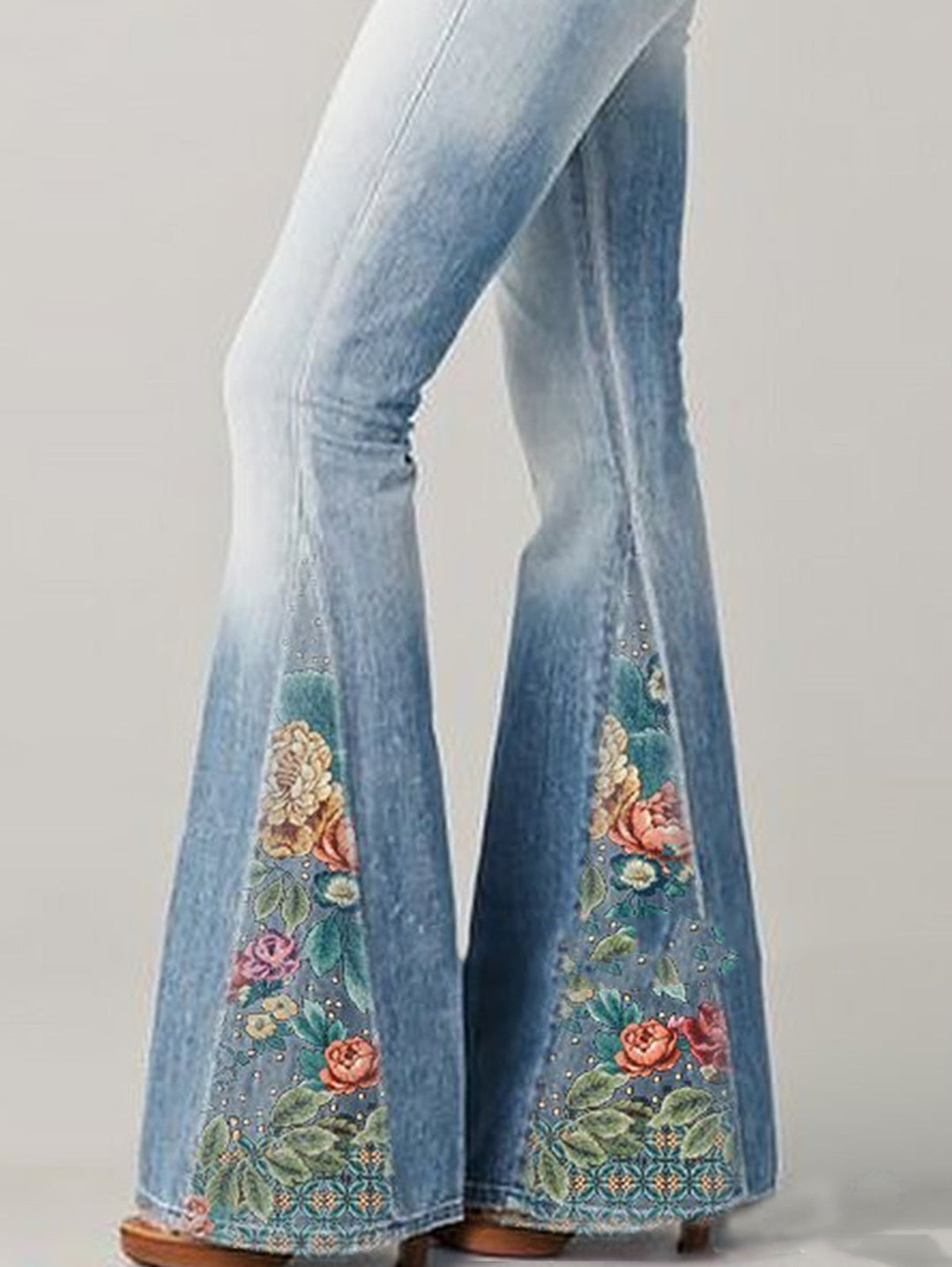 Classic blue wash high-rise women's bootcut jeans, enhanced with beautiful floral embroidery for a chic look.