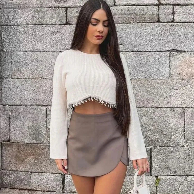 Women's high waist asymmetric mini skirt in a modern & flattering style, perfect for versatile fashion.