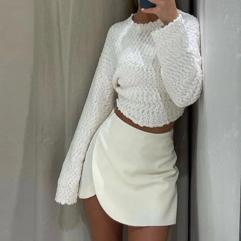 Women's high waist mini skirt featuring an asymmetric hem, creating a modern & chic silhouette. Elegant.