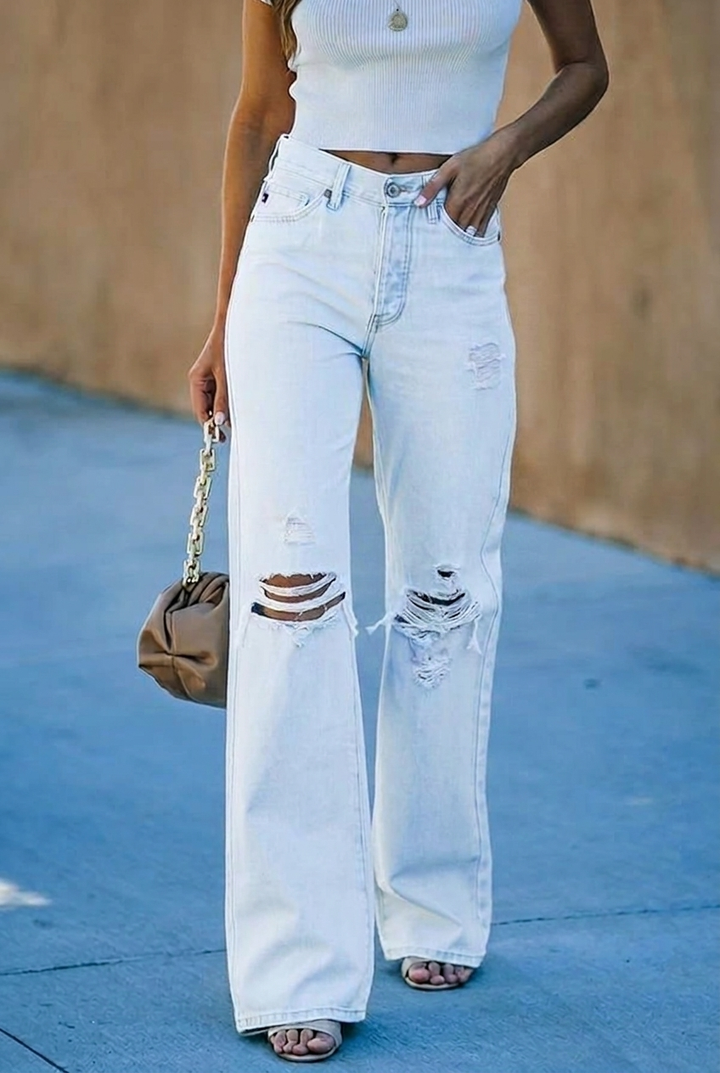 Light wash women's high waist wide leg distressed jeans. Stylish denim pants for a modern casual outfit.