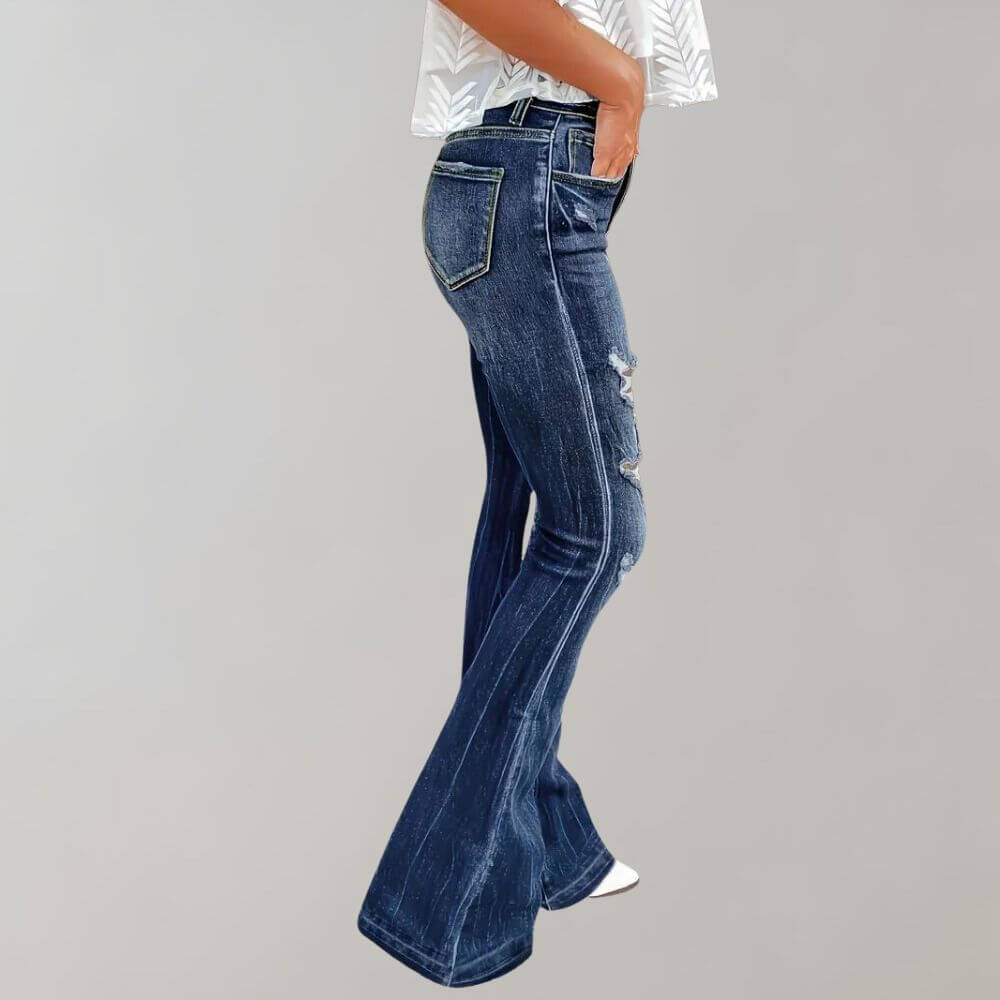Retro style women's high-waisted flared jeans with distressed rips, made from comfortable stretch blue denim.
