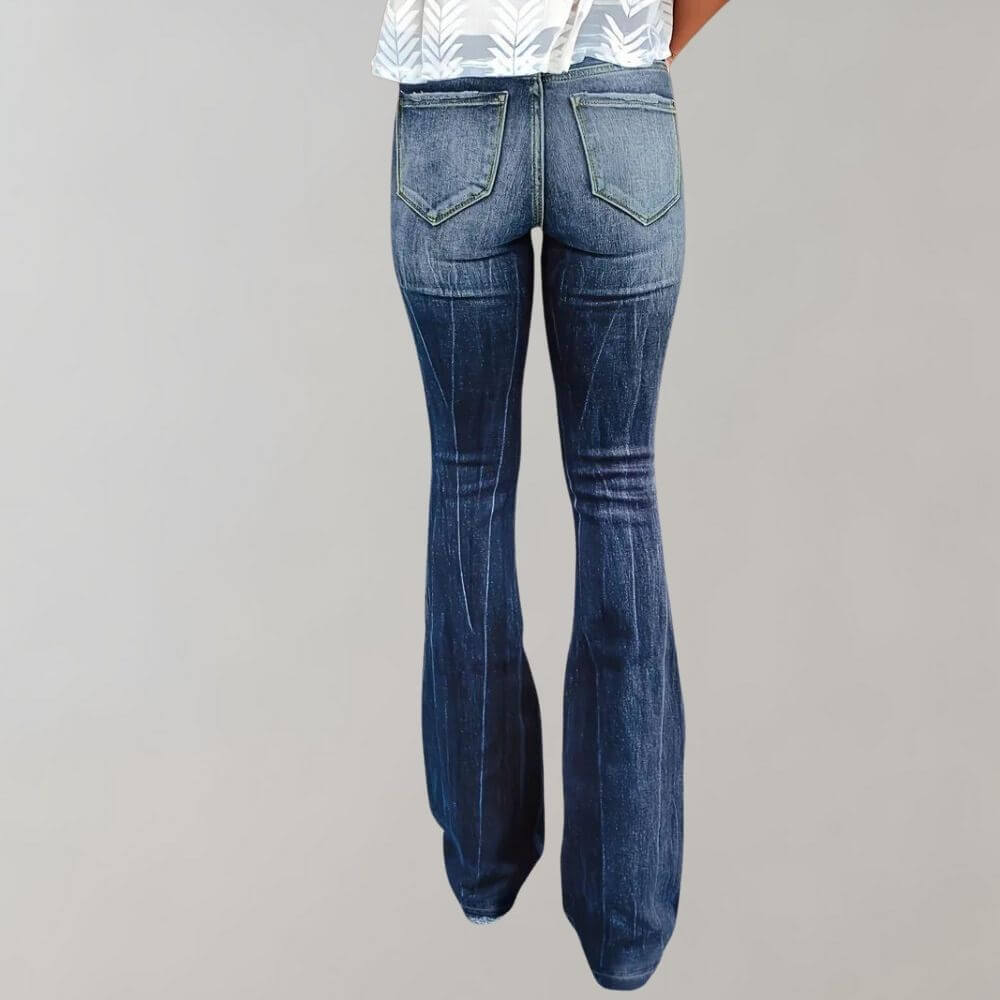 Stylish women's high-waist blue jeans featuring retro flares and trendy rips, ideal for a distressed denim look.