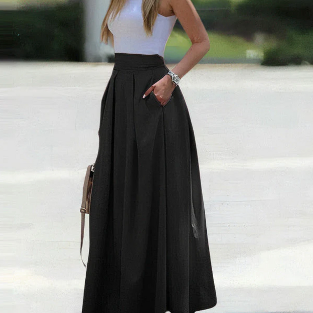 Elegant women's high waist pleated maxi skirt in breathable fabric, perfect for summer casual wear.