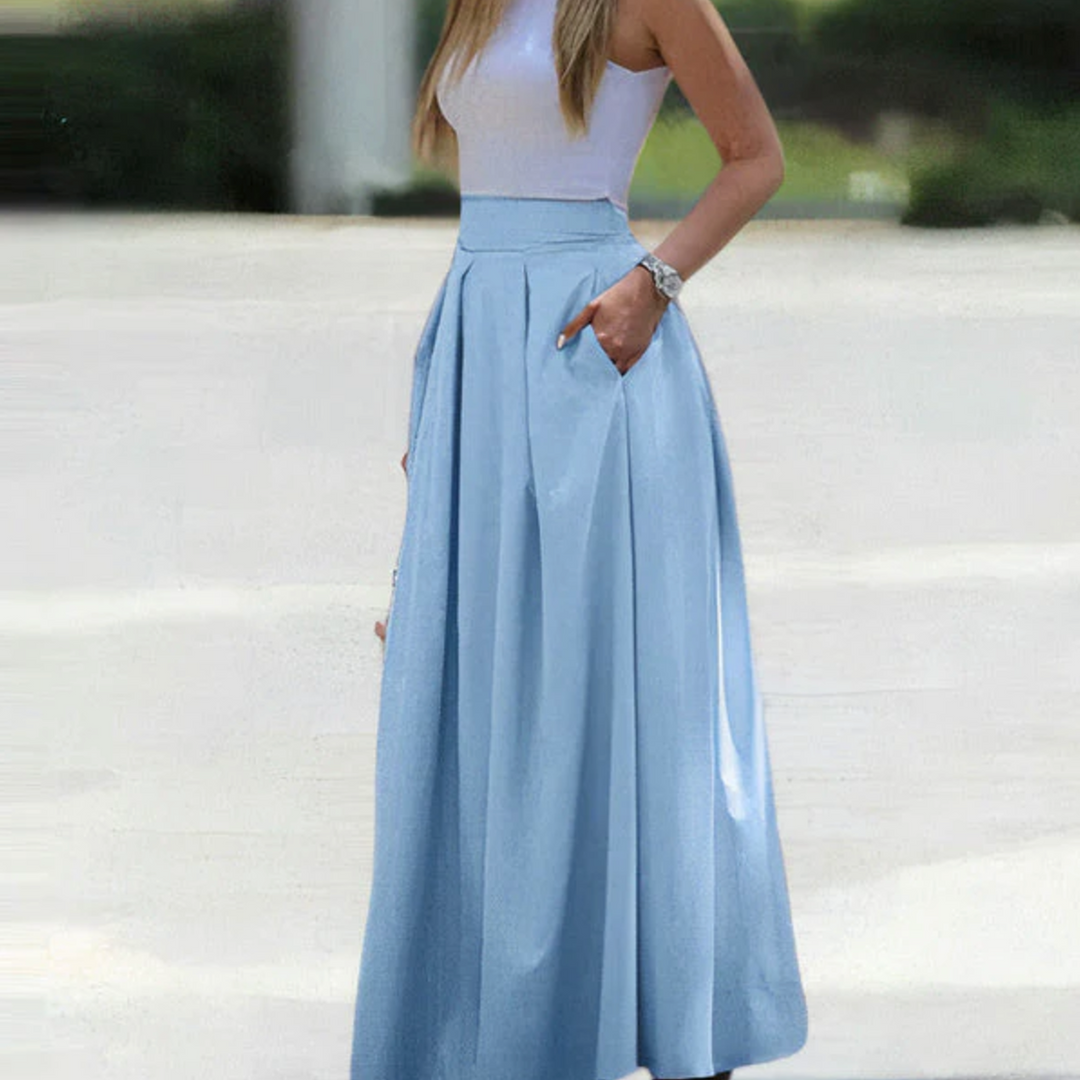Fashionable women's high waist pleated maxi skirt. Breathable fabric ensures comfort and a graceful silhouette.