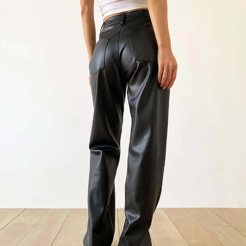 Fall/winter fashion women's high-waist straight-leg vintage leather pants. Elegant and warm black trousers.
