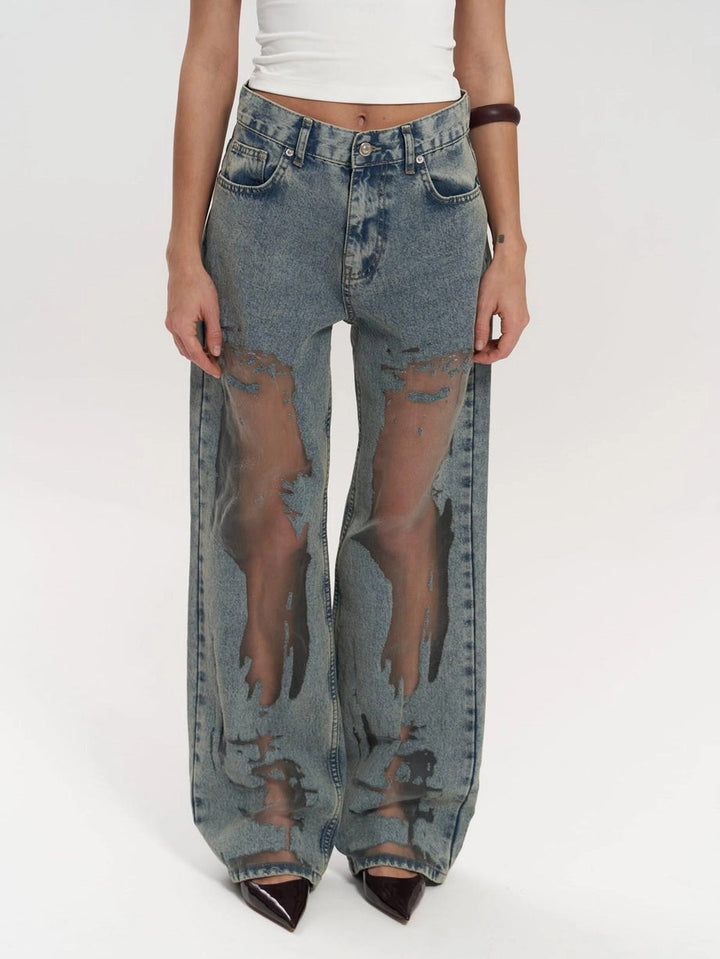 Women's high-waist wide leg jeans with chic panel detail in indigo blue. Modern fashion bottom for comfortable style.