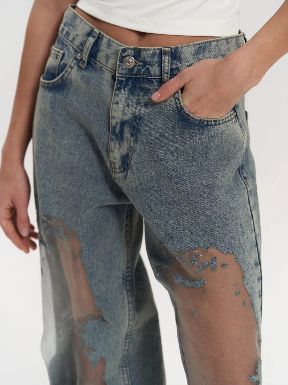 Indigo blue women's high-waist wide leg jeans with a chic panel detail. Perfect modern fashion bottoms.
