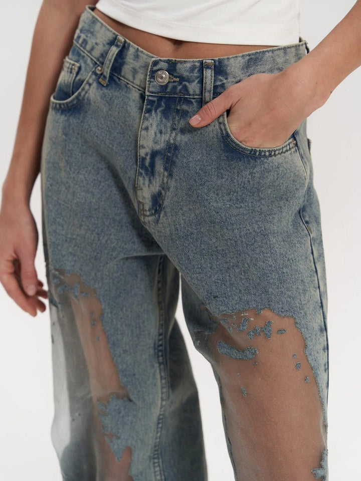 Indigo blue women's high-waist wide leg jeans with a chic panel detail. Perfect modern fashion bottoms.
