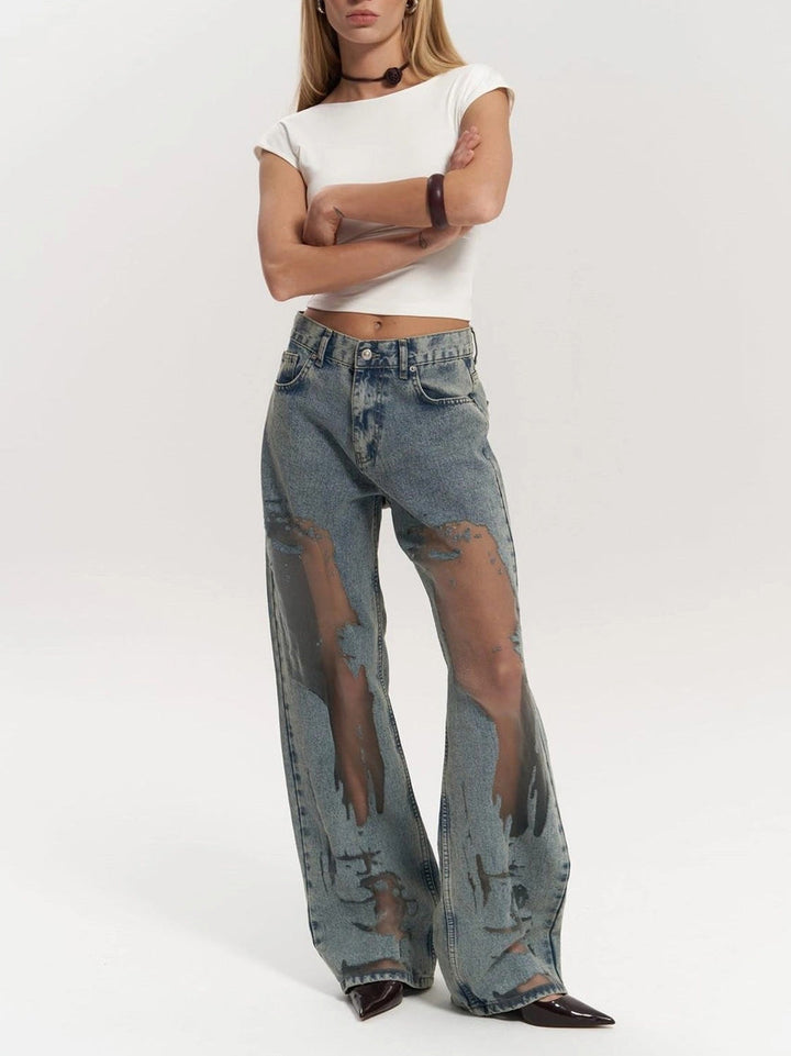 Stylish women's wide leg jeans featuring a high waist and chic panel detail. Modern indigo denim for statement wear.