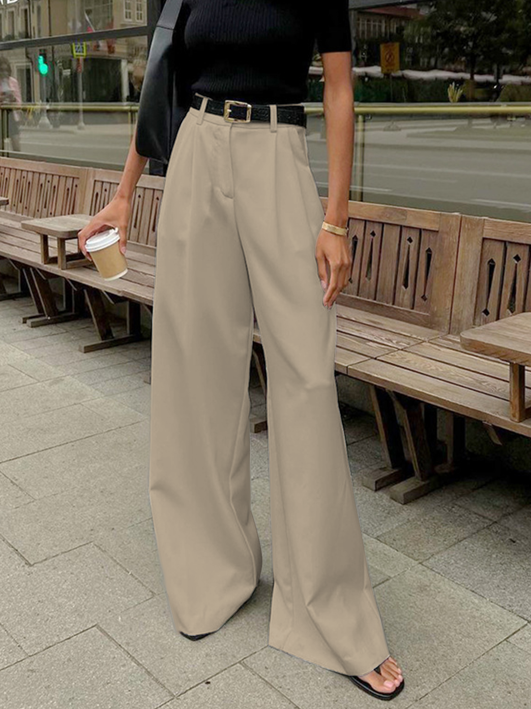 Model in women's high-waist wide-leg tailored formal pants, styled for a modern fashion look.