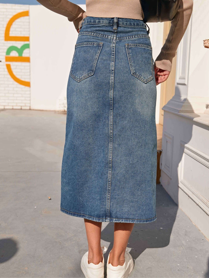 Everyday women's midi denim skirt in classic blue, designed with a comfortable high waist & front slit.