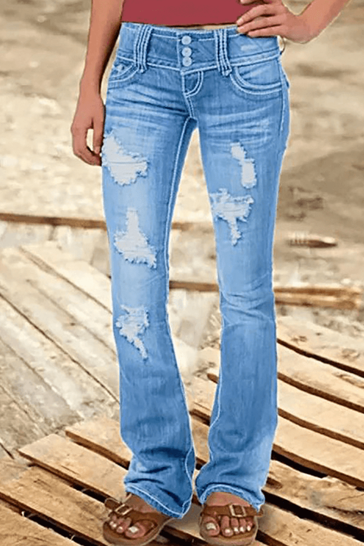 Casual women's blue bootcut jeans, high-waisted with trendy rips. Distressed denim for a comfortable fashion statement.