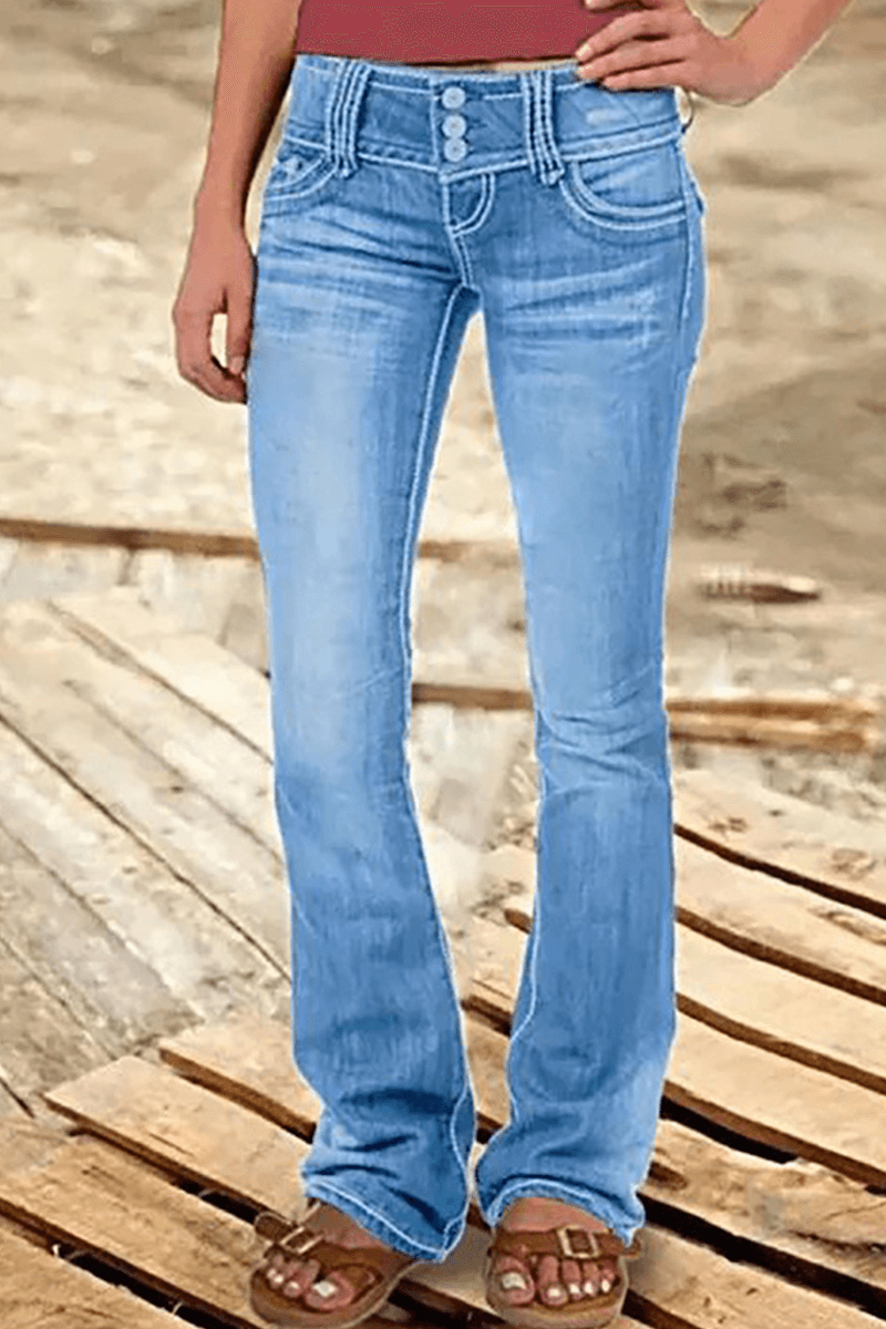 Women's distressed high-waisted bootcut jeans. Light wash denim with stylish rips, ideal for a casual trendy look.