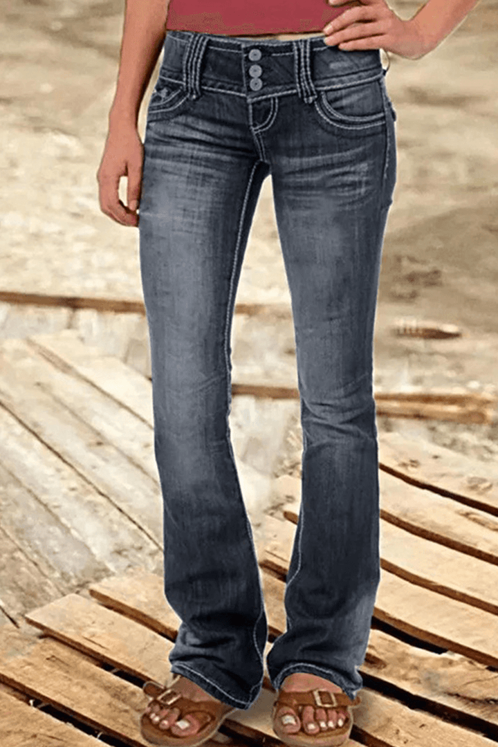 Modern women's bootcut ripped jeans. High-waisted denim with a flattering fit, perfect for trendy casual wear.