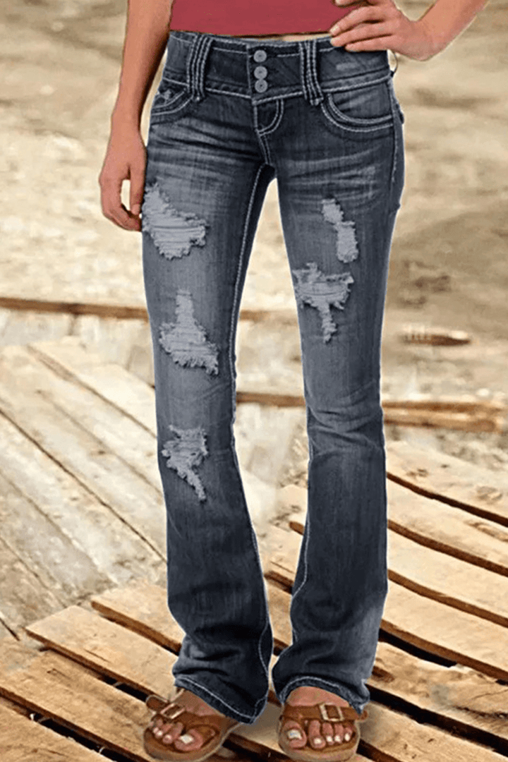 Fashion-forward women's high-waisted bootcut jeans with artistic rips. Distressed denim for a stylish casual outfit.
