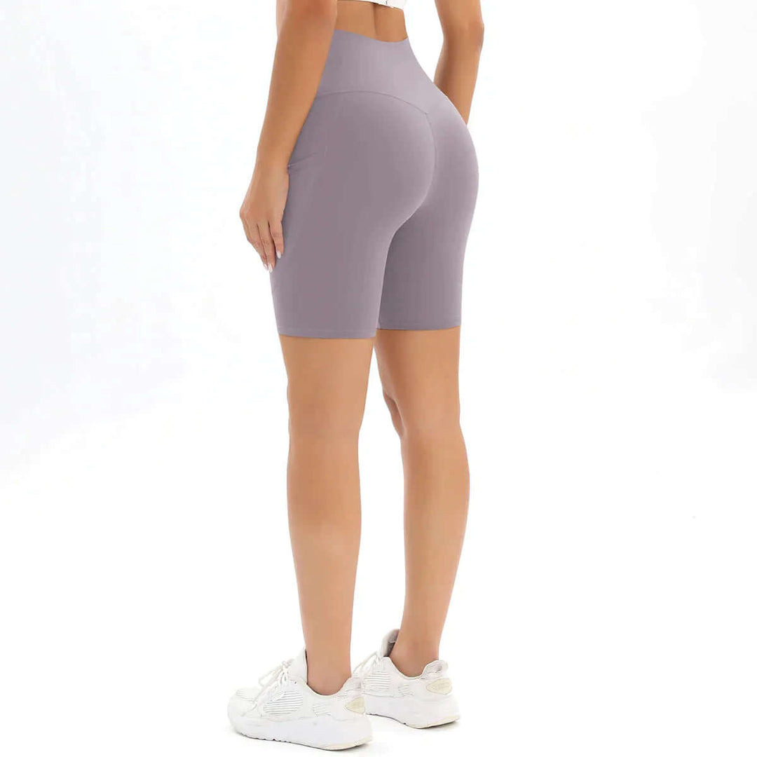 Close-up of women's moisture-wicking high-waisted fitness shorts fabric, showing quality and stretch.