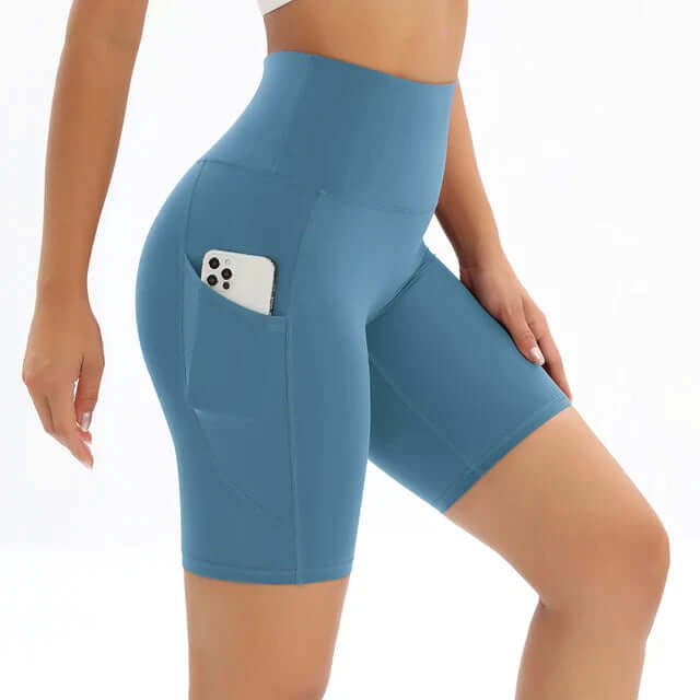 High-waisted athletic shorts for women, featuring a secure side phone pocket for running and yoga.