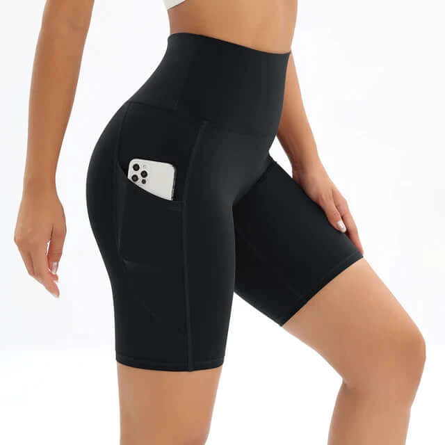 Stylish women's workout shorts with a high waist and discreet phone pocket, ideal for activewear.